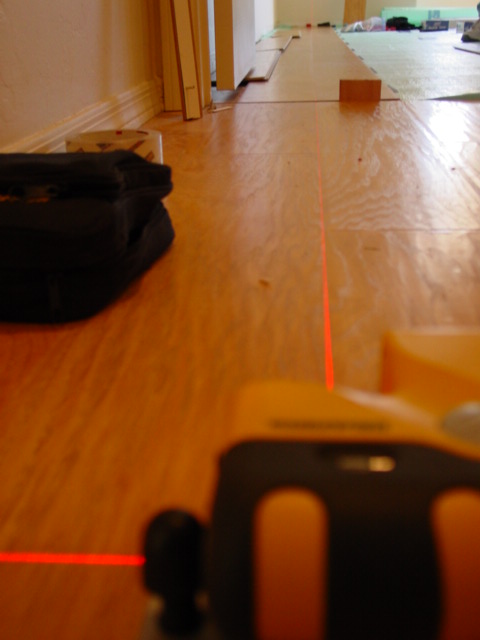 Precision laser alignment off existing 3 year old laminate installation in hallway. Now I can make the cuts along the wall and start installing the room. Quickstep laminate in Green Valley Precision laser alignment off existing 3 year old laminate installation in hallway. Now I can make the cuts along the wall and start installing the room. Quickstep laminate in Green Valley