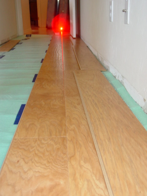 Precision laser alignment off existing 3 year old laminate installation in hallway. Now I can make the cuts along the wall and start installing the room. Quickstep laminate in Green Valley Precision laser alignment off existing 3 year old laminate installation in hallway. Now I can make the cuts along the wall and start installing the room. Quickstep laminate in Green Valley